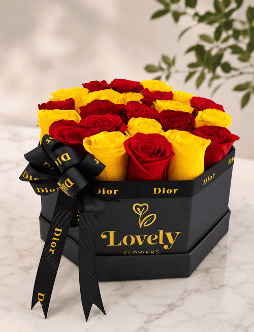 Black Hexagonal Box with 25 Red and Yellow Roses