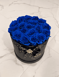 Round Box of blue roses for him